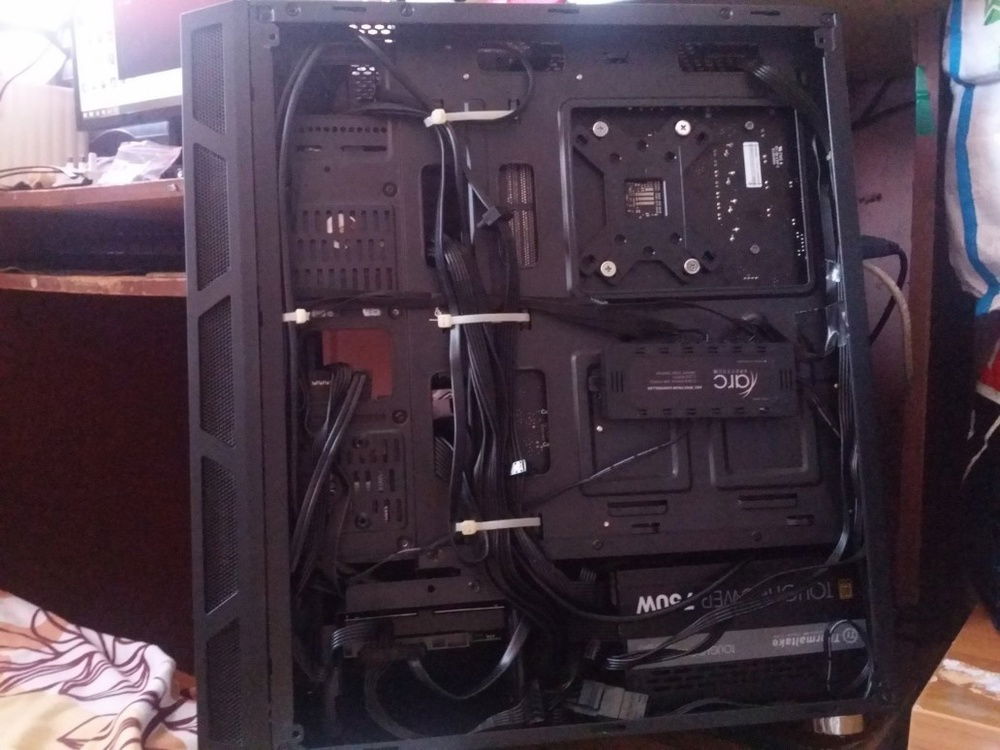 My terrible cable managing skills. Haha go roast me in the comments about it xD. [Also my Western Digital 1TB Hard Drive is located at the bottom left in this image.]