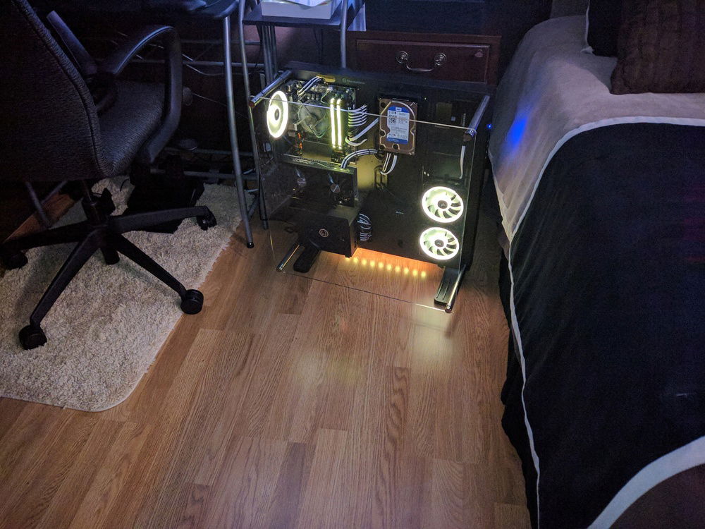Best photo I could get with the RGB lighting on. The lighting is as followed: 3x Corsair LL120 fans, 2x sticks of  Corsair Vengeance Pro RGB RAM, and 4x Corsair RGB light strips. There is one strip behind the GPU for up lighting, two strips in the top of the case for internal down lighting, and one strip for under glow.