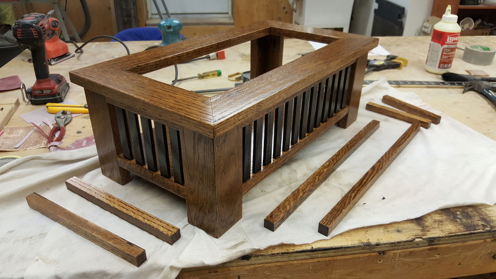 A custom designed and built oak stand for the computer so it doesn't sit on the floor.
