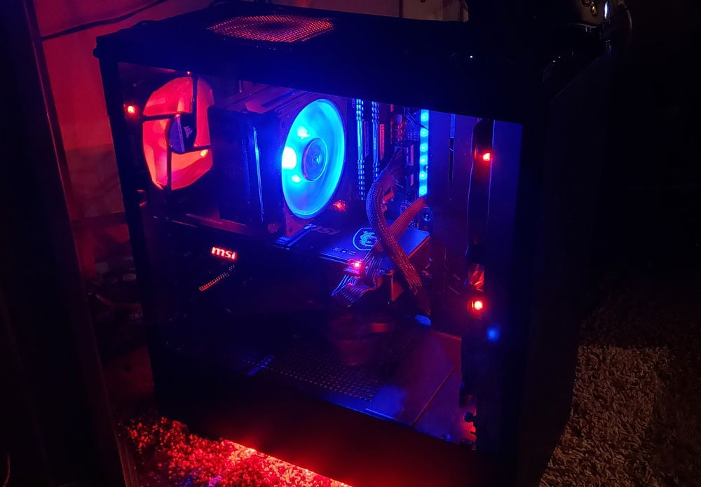 Red and Blue balanced in a black case. I left out everything that I could get away with (ie. sound card, optical drive, etc,) to keep it open, clean and with plenty of airflow.