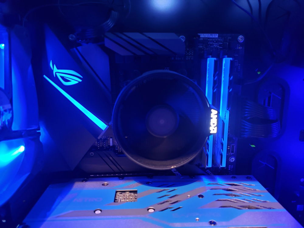 Shows the CPU cooler, Ram, and motherboard.