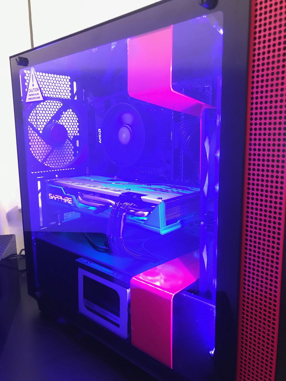 Side view showing the MX300 SSD, the Sapphire Nitro+ RX590, CPU, RAM, and MOBO