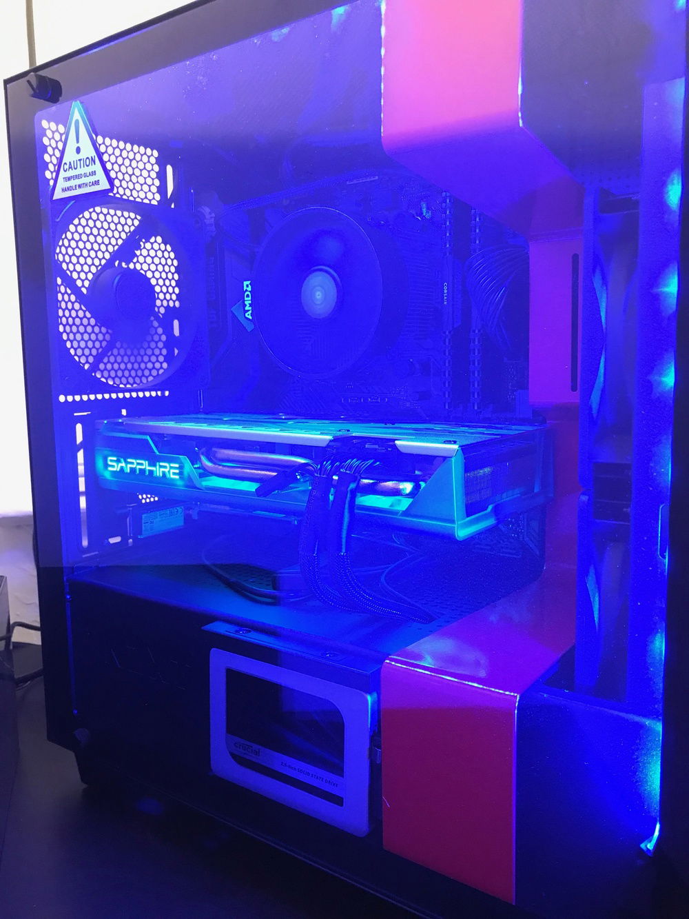 Side view showing the MX300 SSD, the Sapphire Nitro+ RX590, CPU, RAM, and MOBO